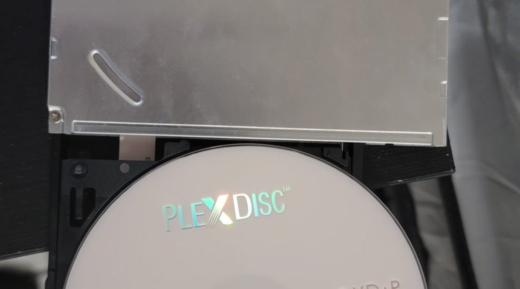 The LiteOn (PLDS) DU-8A5LH Optical Drive with a PlexDisc DVD+R disc.
