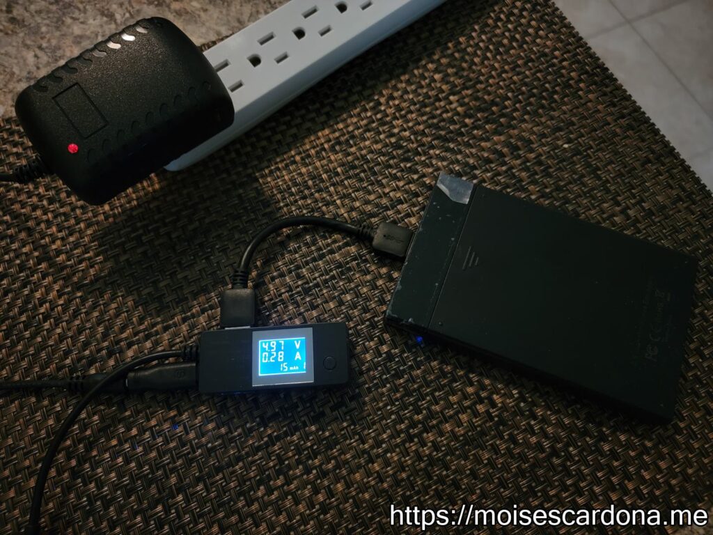 11 - ALITOVE 5V 3A Power Adapter connected to the USB meter with USB Hard Disk Drive connected to it