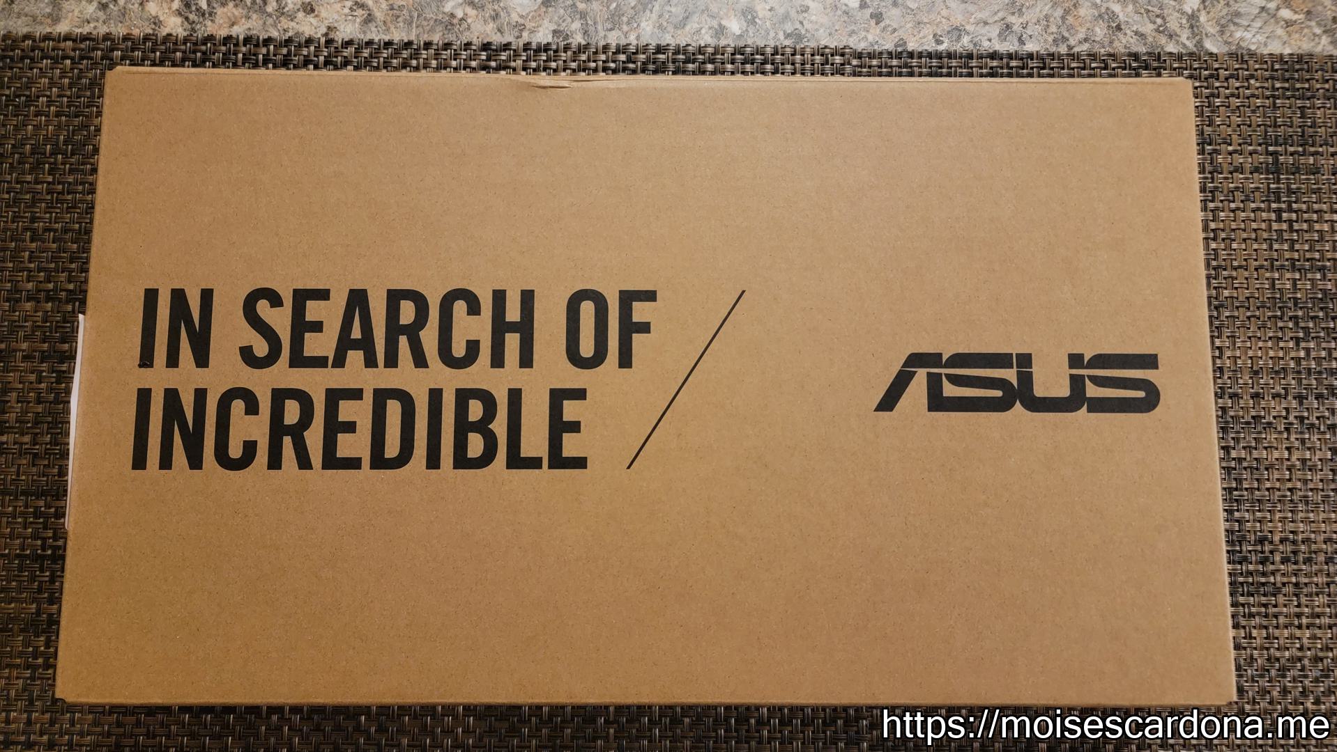 ASUS E210MA 11.6 inch laptop - 1 - Box Front - Unopened